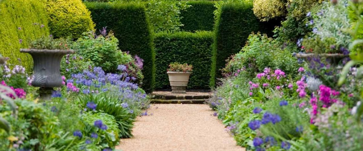 A herbaceous border in full flower along a path